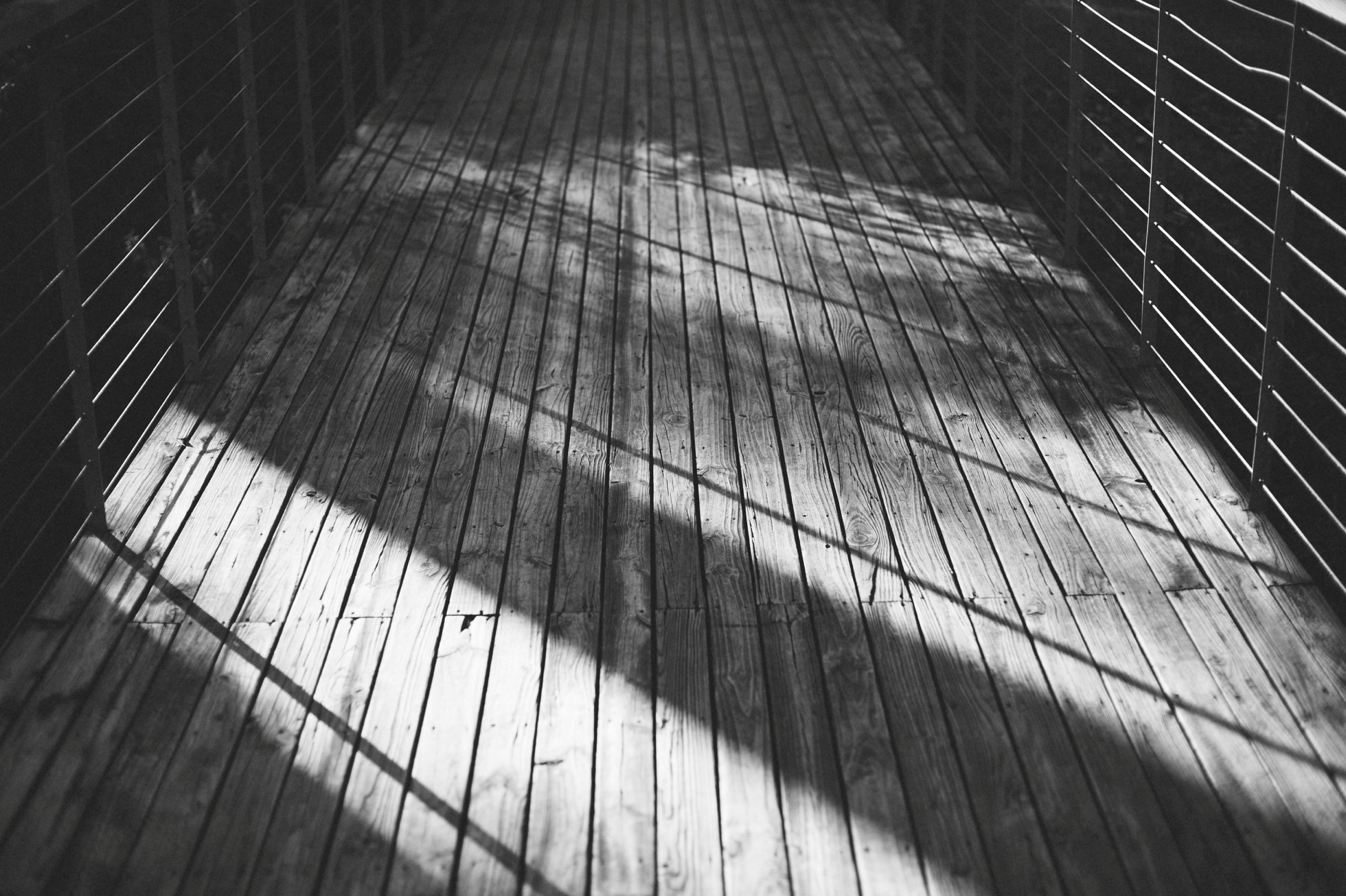 shadows across wooden deck