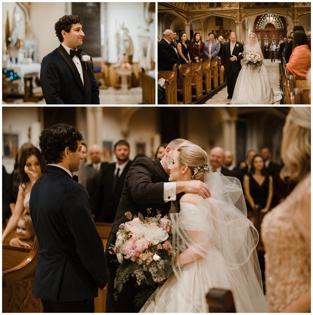 Groom with dark, curly hair catches his first glimpse of his bride as she walks up the aisle in church with her father and they only have eyes for each other in this traditional wedding